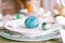 happy easter holiday in springtime season. painted green emerald colored eggs in bowl and plate on table