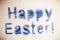 happy Easter inscription in bright sequins on white background