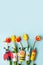 Happy easter kindergarten decoration concept - rabbit, chicken, egg, bee from toilet paper roll tube, fresh tulips. Simple diy.