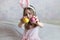 happy Easter. A little girl with long blonde hair breaks colorful Easter eggs