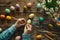 Happy Easter Painting Table Top View, Family Hands are Painting Easter Eggs, Celebration Preparing