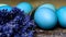 Happy Easter rustic concept. DIY dyed various shades of blue Easter eggs with dried lavender on retro rusty metal background.