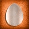 Happy Easter - shape of egg on orange background