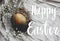 Happy Easter text. Easter greetings card. Stylish easter egg in rustic nest on wooden table. Natural dyed green easter egg with