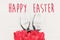 Happy Easter text. season`s greetings card. bunny ears and styli