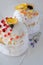 Happy Easter, traditional Russian easter cake Kulich on a white background, decorated with color decorations