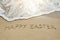 Happy easter written on sand