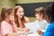 Happy educator with children in painting class