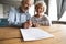 Happy elderly couple close insurance contract put signature