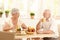 Happy elderly couple having breakfast