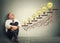 Happy elderly executive man relaxed sitting on a floor in his office looking up