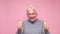 Happy elderly woman holding her thumb up