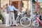 Happy elderly woman and man buying new bicycle in shop