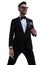 Happy elegant man in tuxedo looking to side and smiling