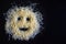 Happy emoji of pasta on a dark background.