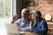 Happy emotional middle aged family couple enjoying video call conversation.