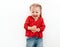 Happy emotions of Little girl dressed red blouse on the white background