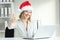 Happy employee with thumbs up at office in christmas