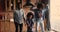 Happy energetic african american family dancing in kitchen.