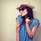 Happy enjoyment young woman in sun glasses and hat posing. Vintage toned portrait