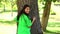 Happy environmental activist hugging a tree