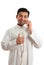 Happy ethnic businessman on phone