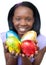 Happy ethnic woman showing Easter eggs