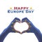 Happy Europe day with European Union EU flag pattern on people`s hands in heart shape isolated on white background