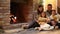 Happy european family with children sitting on floor by fireplace reading