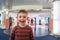 Happy and excited boy in front of a store eager to go in shopping.