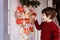 Happy excited little boy waiting to start opening handmade advent calendar