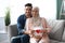 Happy Expectation. Muslim Couple Holding Red Paper Heart Near Woman's Pregnant Belly