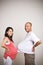 Happy expecting pregnant asian couple