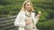 Happy expecting woman biting green apple, stroking belly, maternity health care