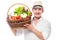 Happy experienced farmer with a harvest of vegetables in a basket on a white background