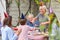 Happy extended family celebrates birthday with cake