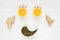 Happy face of fruit and seeds. The smiling face is made from oranges, garlic, ginger and pumpkin seeds. Background of useful