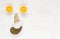 Happy face of fruit and seeds. The smiling face is made from oranges and pumpkin seeds, nose of ginger. Background of useful