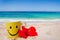 Happy face mug with red hibiscus on the beach
