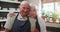 Happy, face and old couple in kitchen hug with love, support and care in marriage or retirement. Elderly, man and woman