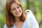 Happy falconer holding a falcon looking it