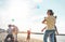 Happy families flying with kite and having fun on the beach - Parents playing with children outdoor - Love, and weekend holidays