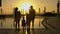 Happy family admiring the sunset by the pool