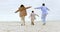 Happy family, airplane game and beach in nature or support love, relax and calm holiday. Young man, woman and child with