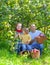 Happy family with apple harvest