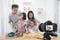 Happy family asian making a Vlog video blogger digital camera with cooking