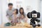 Happy family asian making a Vlog video blogger digital camera with cooking