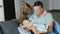 Happy family with a baby at home. Mother, father and son two months. Concept - marital happiness, the comfort of home, a