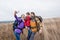 Happy family with backpacks taking selfie