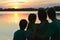 Happy family on beach looking on pond